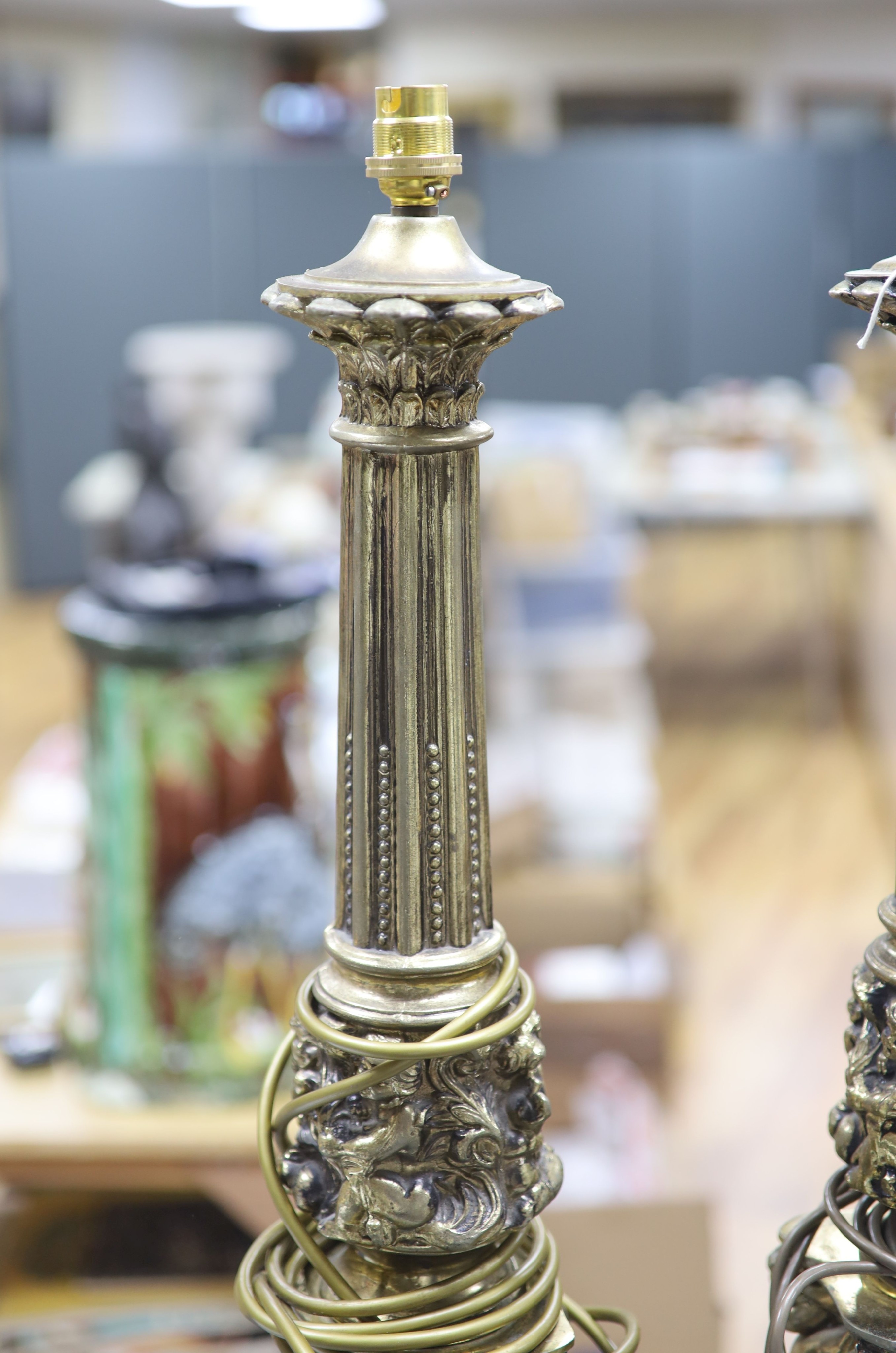 A pair of gilt metal column lamp bases, total height 61 cm